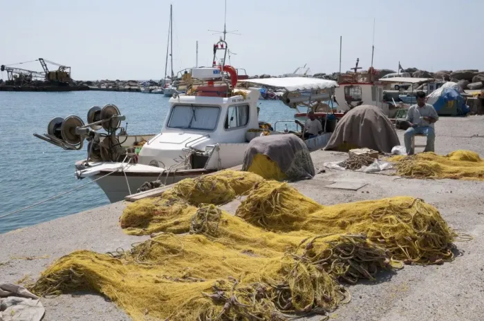 Framed Print : Fisherman repairing nets on harbour, Vlychada, Santorini, Cyclades, Aegean Sea, Greece, September Framed Print : Fisherman repairing nets on harbour, Vlychada, Santorini, Cyclades, Aegean Sea, Greece, September