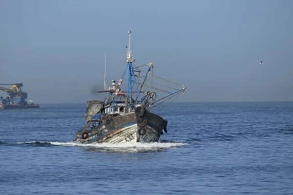 Fishing boat with beam trawls at sea, Morocco, November