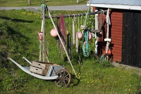 Fishing floats, nets and boxes in fishing village, Trollharens, Gastrikland, Norrland, Baltic Sea, Sweden, august