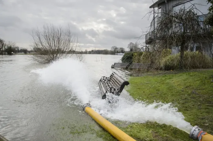 Framed Print : Floodwater pumped back into river during flood, River Thames, Chertsey, Surrey, England, February 2014 Framed Print : Floodwater pumped back into river during flood, River Thames, Chertsey, Surrey, England, February 2014