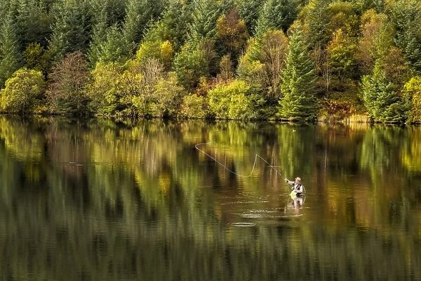 Fly fishing in reservoir, Cantref Reservoir, Taff Fawr Valley, Brecon Beacons N. P. Powys, Wales, October