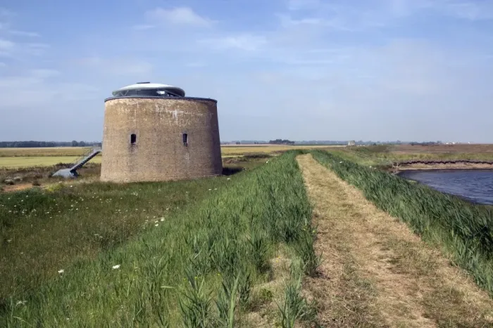 Framed Print : Foot path on sea wall looking towards Hollesley with Martellow Tower X -Suffolk