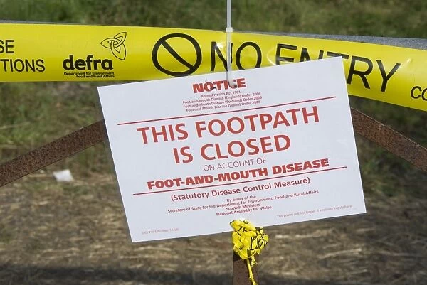 This Footpath is Closed on Account of Foot and Mouth Disease sign on gate in farmland, Surrey, England, September 2007