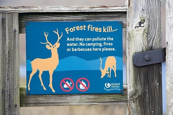 Forest fires kill warning sign on gate, Lake District N. P. Cumbria, England, February