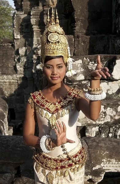 Girl dancer wearing Apsara (dancer) costume in Khmer temple, Bayon, Angkor Thom, Siem Riep, Cambodia