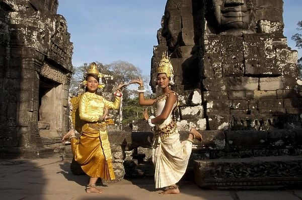 Girl dancers wearing Apsara (dancer) costume in Khmer temple, Bayon, Angkor Thom, Siem Riep, Cambodia
