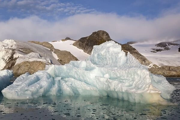 Glacial iceberg in fjord, Raudfjorden, Spitsbergen, Svalbard, August