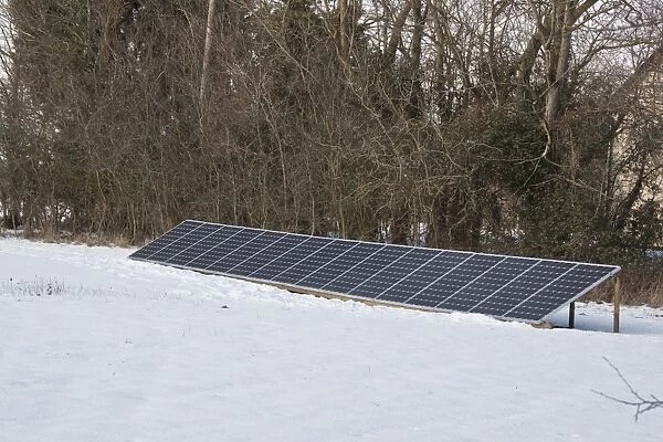 Ground mounted solar panels in winter snow