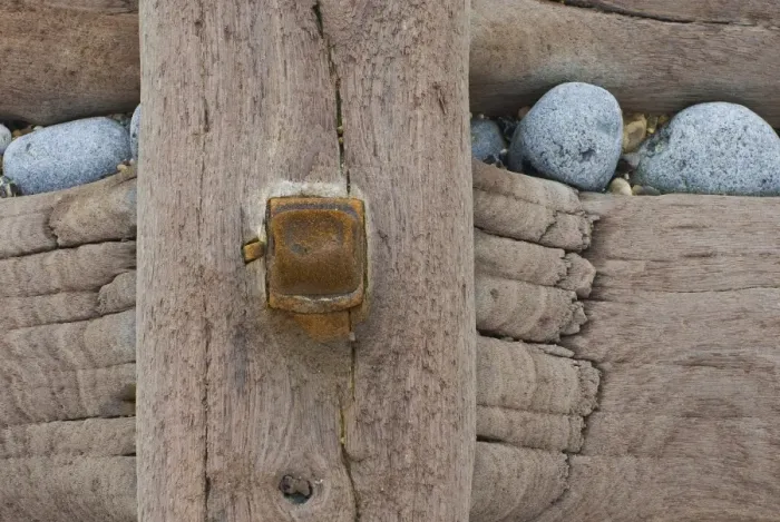 Framed Print : Groynes, abstract view of rusty bolt and pebbles stuck in weathered timber, West Runton, Norfolk, England Framed Print : Groynes, abstract view of rusty bolt and pebbles stuck in weathered timber, West Runton, Norfolk, England