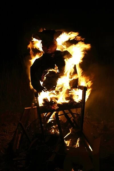 Guy burning on garden bonfire, Guy Fawkes Night, Bacton, Suffolk, England, November