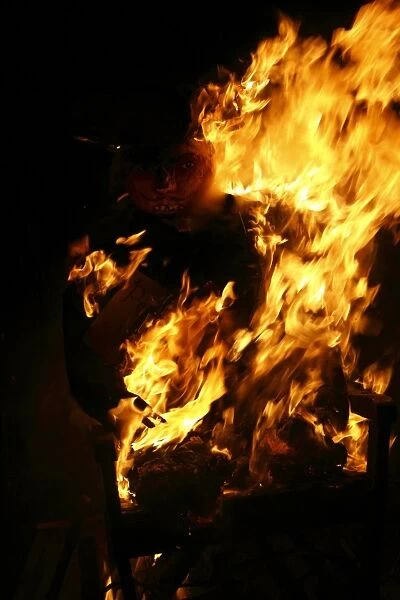 Guy burning on garden bonfire, Guy Fawkes Night, Bacton, Suffolk, England, November