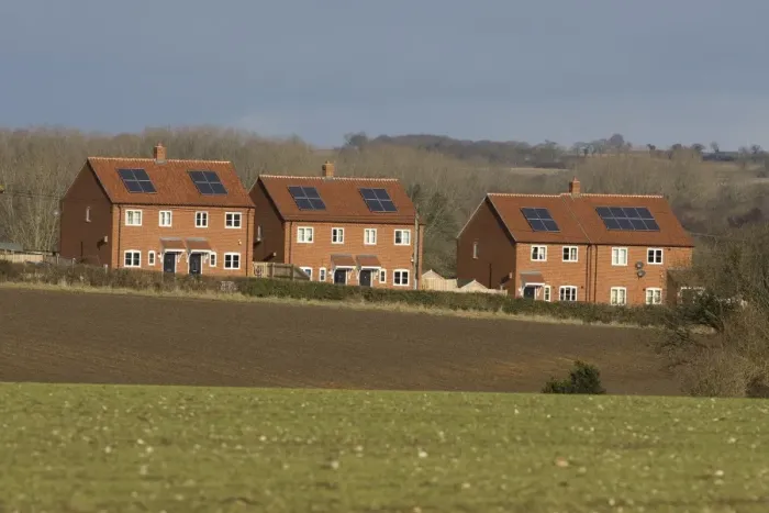 Framed Print : Houses with solar water heating panels on roof, Norfolk, England, march