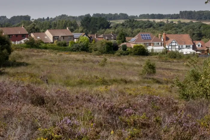 Framed Print : Housing development along edge of internationally important heathland habitat, Dunyeats Hill Nature Reserve Framed Print : Housing development along edge of internationally important heathland habitat, Dunyeats Hill Nature Reserve