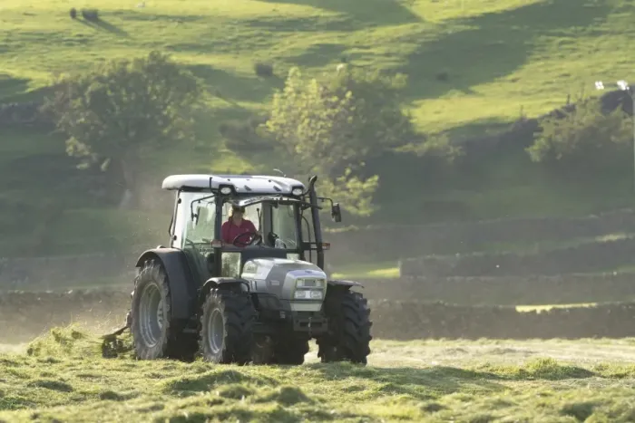 Framed Print : Hurlimann tractor with tedder, turning grass in upland hay meadow, Swaledale, Yorkshire Dales N. P Framed Print : Hurlimann tractor with tedder, turning grass in upland hay meadow, Swaledale, Yorkshire Dales N. P