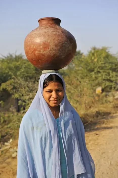 Framed Print : Indian girl carrying water container on head, near Bharatpur, Rajasthan, India, December