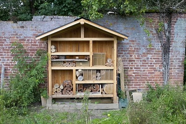 Insect hotel built to attract bees, partly filled, Preston Montford Field Centre, Shropshire, England, August