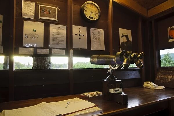 Interior of forward hide where volunteers and staff monitor ospreys, showing huge binoculars taken from German U-boat