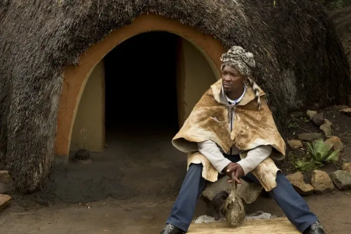 Framed Print : Inyanga herbal healer sitting outside hut in traditional Basutho village, Lesotho, November Framed Print : Inyanga herbal healer sitting outside hut in traditional Basutho village, Lesotho, November