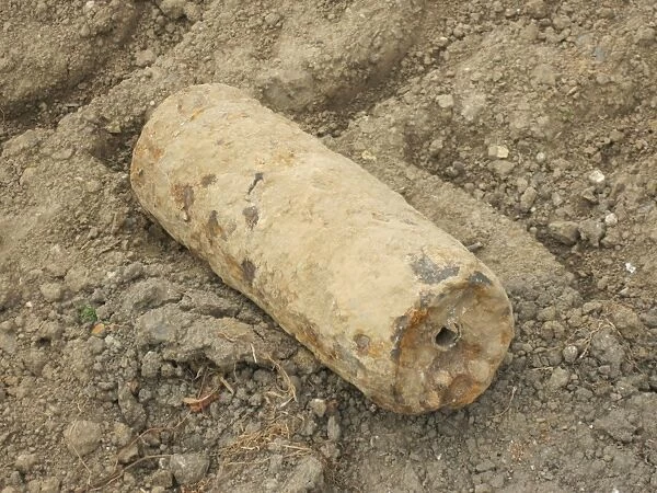 Iron Harvest, World War One shrapnel shell, unexploded with shrapnel balls still inside, Somme Battlefield, Somme