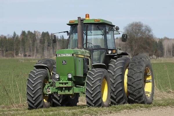 John Deere 4455 tractor with dual wheels, Sweden, may
