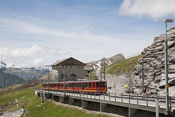 Jungfraubahn train at Eigergletscher Station, Bernese Alps, Switzerland, June