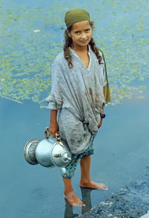 Framed Print : Kashmiri girl, standing in water holding vessel, Dal Lake, Srinagar, Kashmir, India Framed Print : Kashmiri girl, standing in water holding vessel, Dal Lake, Srinagar, Kashmir, India