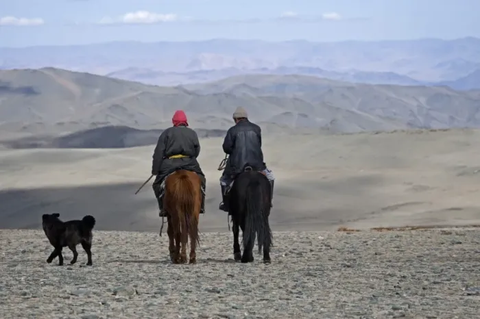 Framed Print : Two Kazakh nomads on horseback with dog, Altai Mountains, Bayan-Ulgii, Western Mongolia, october