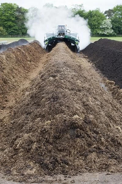 Komptech self-propelled compost turner, turning over rotting bedding manure, England, June
