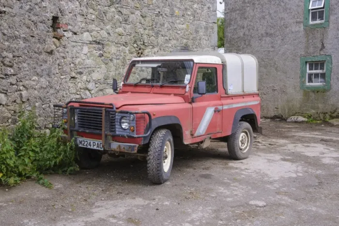 Framed Print : Land Rover Defender in farmyard, Cumbria, England, July Framed Print : Land Rover Defender in farmyard, Cumbria, England, July
