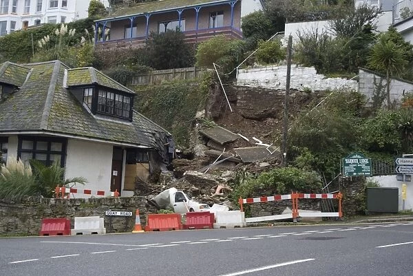 Landslip with van crushed under debris in coastal town, Quay Road, Looe, Cornwall, England, October 2008