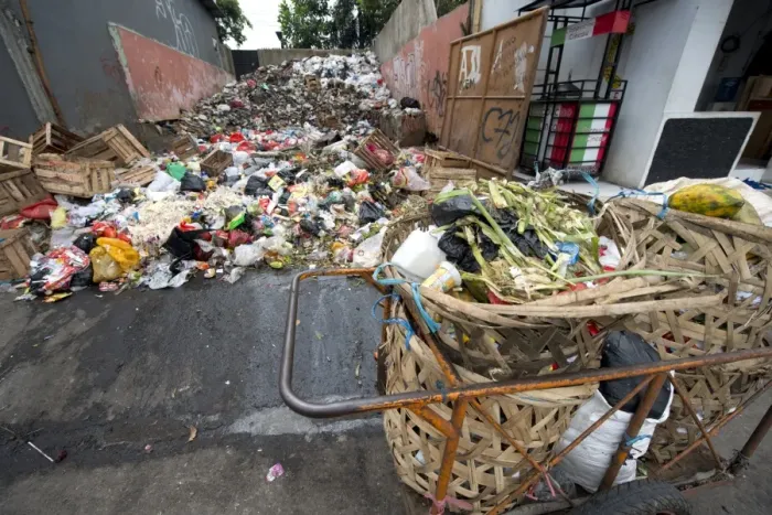 Framed Print : Large pile of rubbish and collection baskets in city, Manggarai District, Jakarta, Java, Indonesia, December