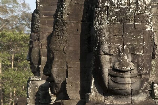 Large sculptures of heads on tower of Khmer temple, Bayon, Angkor Thom, Siem Riep, Cambodia