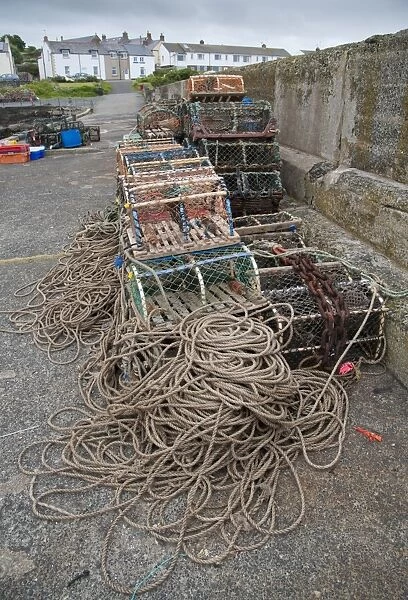 Lobster pots on quayside of harbour, Craster, Northumberland, England, july