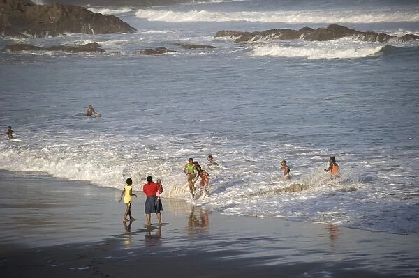 Local people playing in surf, Second Beach, Port St. Johns, Wild Coast, Eastern Cape (Transkei), South Africa
