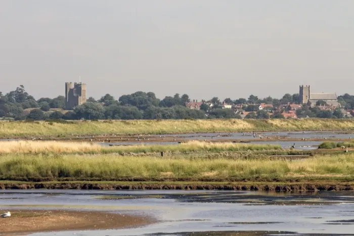 Framed Print : Looking over Havergate Island Marsh towards Orford, which shows the castle and church. - Suffolk Framed Print : Looking over Havergate Island Marsh towards Orford, which shows the castle and church. - Suffolk