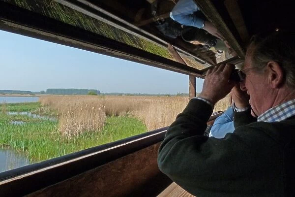 Looking out from Island mere hide at RSPB Minsmere Suffolk, a great place to watch birds and wildlife with binoculars