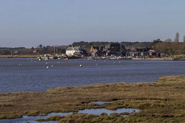 Looking south to Orford, Quay. on the River Alde with tidal salt marsh. Suffolk