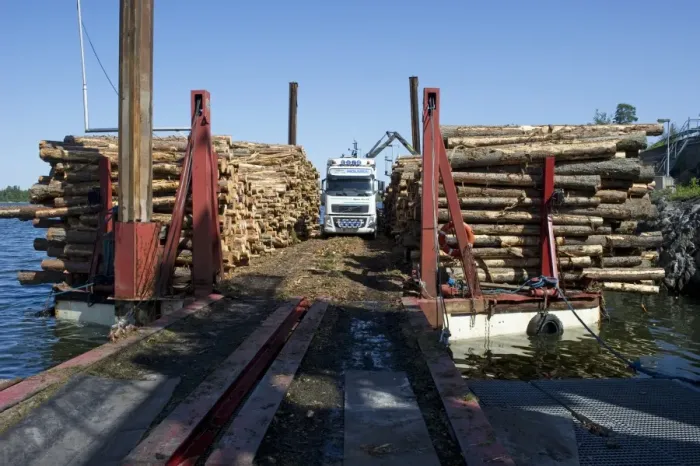Framed Print : Lorry with grapple loading logs onto timber barge, Archipelago Sea, Baltic Sea, Sweden, june Framed Print : Lorry with grapple loading logs onto timber barge, Archipelago Sea, Baltic Sea, Sweden, june