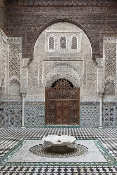 Madrasah courtyard with fountain in city, Al-Attarine Madrasa, Fes el Bali, Fes, Morocco, april