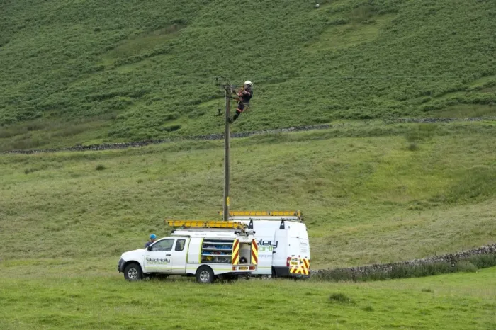 Framed Print : Mains electric technicians repairing cable on rural electricity pole, Cumbria, England, July Framed Print : Mains electric technicians repairing cable on rural electricity pole, Cumbria, England, July