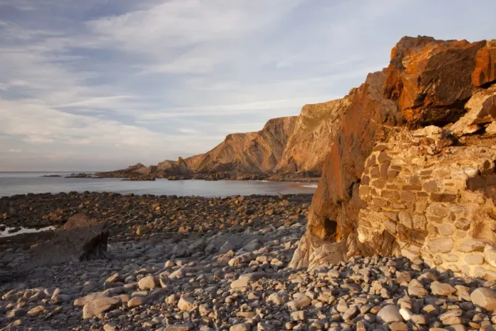 Framed Print : Manmade seawall and coastal cliff with folded strata at sunset, Warren Cliffs, Hartland, North Devon, England, October Framed Print : Manmade seawall and coastal cliff with folded strata at sunset, Warren Cliffs, Hartland, North Devon, England, October