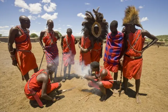Framed Print : Masai tribesmen lighting fire at edge of village, Masai Mara, Kenya Framed Print : Masai tribesmen lighting fire at edge of village, Masai Mara, Kenya