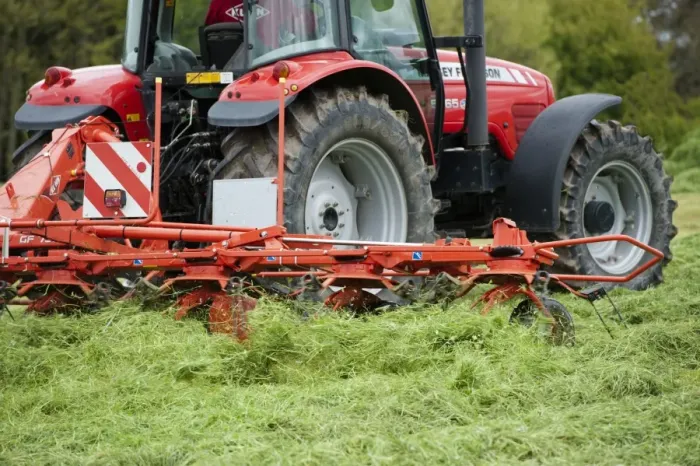Framed Print : Massey Ferguson tractor with tedder working in field of newly mown grass for silage, Cumbria, England, May Framed Print : Massey Ferguson tractor with tedder working in field of newly mown grass for silage, Cumbria, England, May