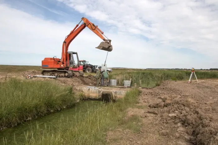 Framed Print : Metal pilings being fitting to make a sluice gate to retain water at Deepdale Marsh, Burnham Deepdale, North Norfolk Framed Print : Metal pilings being fitting to make a sluice gate to retain water at Deepdale Marsh, Burnham Deepdale, North Norfolk