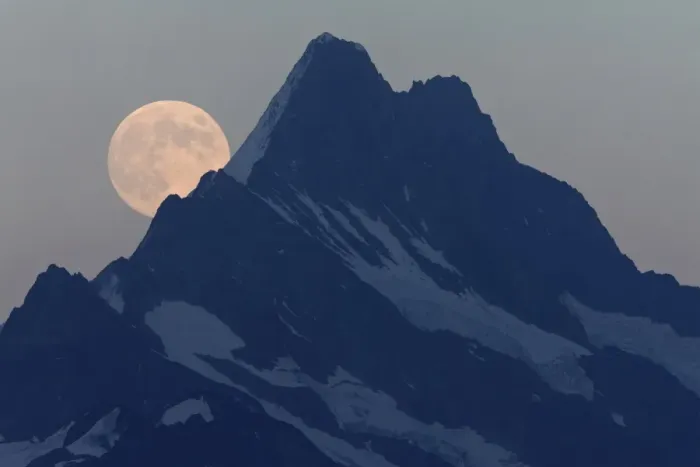 Framed Print : Full Moon rising over mountain peak at dusk, Schreckhorn, Swiss Alps, Bernese Oberland, Switzerland, August
