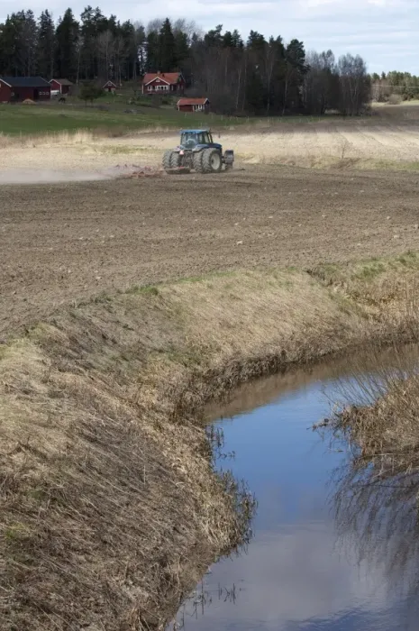 Framed Print : New Holland 8770 tractor with harrows, harrowing field seedbed beside small river, Sweden, may Framed Print : New Holland 8770 tractor with harrows, harrowing field seedbed beside small river, Sweden, may