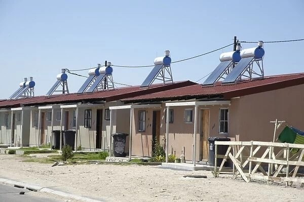 New housing with solar water heating on roof, Langa Township, Cape Town, Western Cape, South Africa