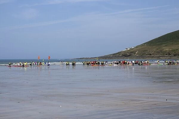 The north end of Saunton Sands beach at low tide with a surfing class