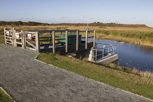 North wall water control sluice gates at RSPB Minsmere Suffolk, looking north to Dunwich