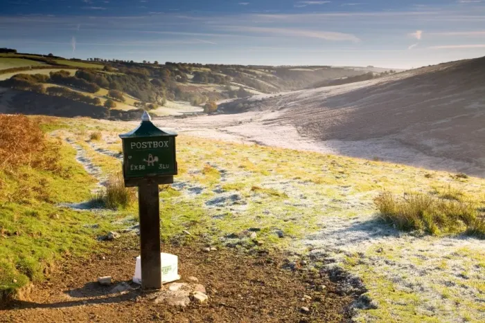 Framed Print : Old postbox by roadside, with melting frost in morning sunshine, looking towards River Barl, Landacre, Exmoor N. P